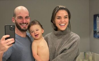 Jake Udell with wife and child