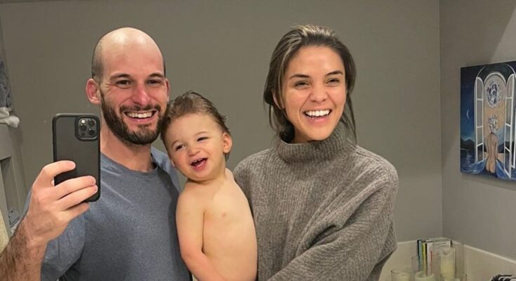 Jake Udell with wife and child